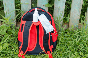 back to school with schoolbag medical face mask and sanitizer after epidemic Coronavirus, MERS-CoV,...