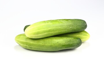 Fresh and organic cucumber isolated on the white background. Famous side dish vegetable ingredients for food decoration. 
