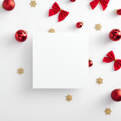 Red christmas ball and gold snowflake with empty paper blank