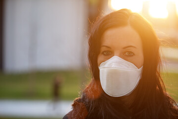 Woman in city with a face mask against infection and viruses such as corona virus, sars or flu.