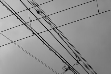 Cable car lines below overcast sky
