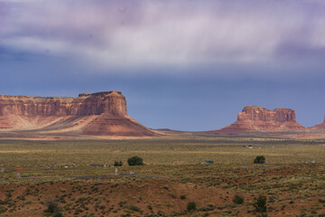 Fototapeta na wymiar Monument Valley famous arid red-sand landscape with outstanding geological rock buttes and mesas