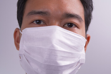 Man with face mask against virus bacteria prevention outbreak. The concept health and safety, N1H1 coronavirus quarantine, virus protection