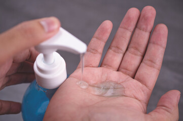 Hands washing with alcohol gel to eliminate bacteria and viruses. Coronavirus hand sanitizer gel for clean hands hygiene coronavirus spread prevention