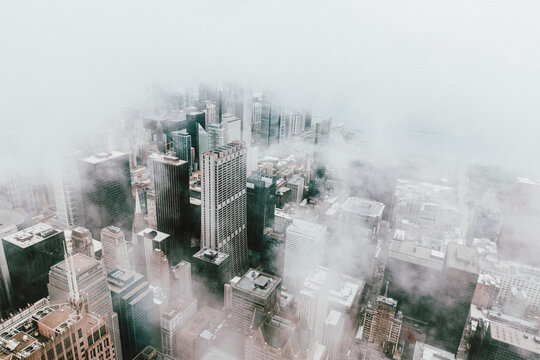Aerial view highrise buildings in fog, Chicago, Illinois, USA
