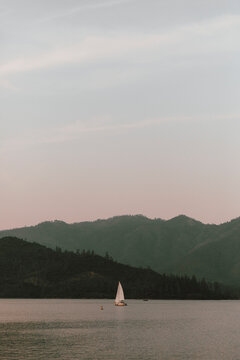 Sailboat on tranquil Whiskeytown Lake, Redding, California, USA
