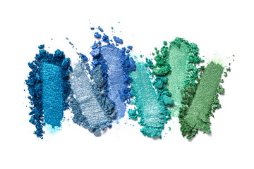Fototapeta na wymiar Close-up of make-up swatches. Smears of crushed shiny blue, green and turquoise eye shadow