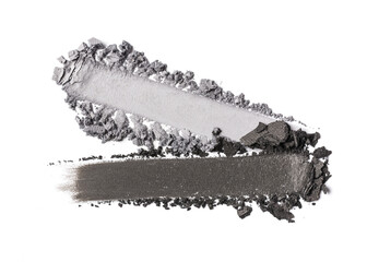Close-up of make-up swatches. Smears of crushed shiny silver and grey eye shadow