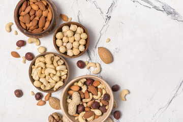 Bowls with nuts mix as snack or ingredient for tasty dessert, meal