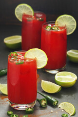 Jalapeno tomato margarita cocktail with lime