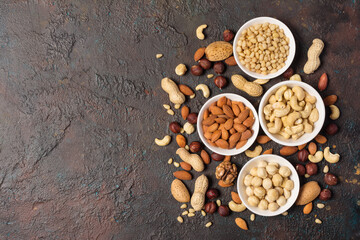 White bowls with nuts mix as snack or ingredient for tasty dessert, meal