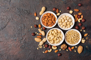 White bowls with nuts mix as snack or ingredient for tasty dessert, meal