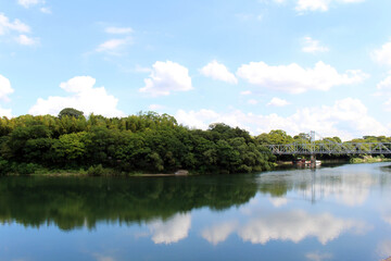 Bridge connecting Okayama Korakuen Garden and its reflection