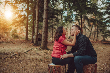 Young couple kissing in forest