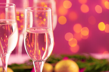 Close up photo of Champagne glasses against bokeh background