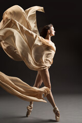 Ballerina Dance with Silk Fabric, Ballet Dancer in Pointe Shoes, Flying Beige Cloth, Gray Background