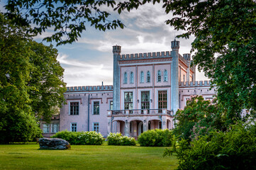 View of the pink castle through the park. Vecauce Manor.