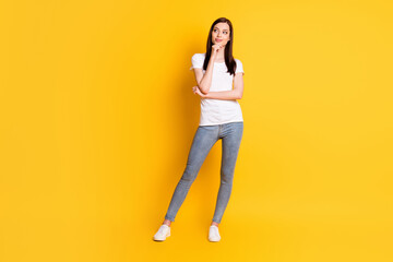 Full body photo of minded girl touch hand chin look copyspace think thoughts decide decision choose choice wear white outfit gumshoes isolated over bright color background