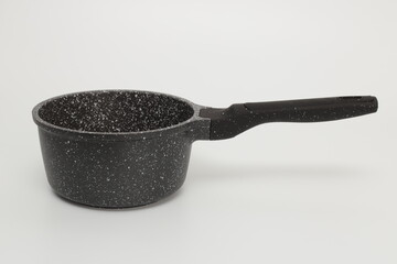 Black casserole on a white background.