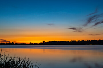 Fototapeta na wymiar Just after sunset beautiful colors appear above lake Zoetermeerse plas