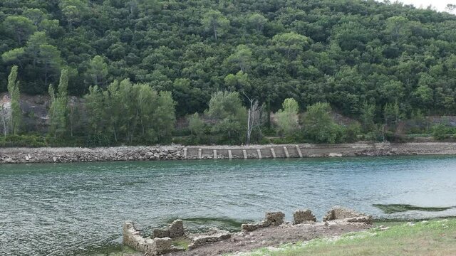 Set of ruins on the edge of the Carc&egrave;s lake in Provence Var, visible during low water level in very hot and dry summer 