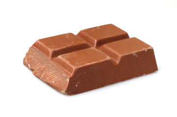 Piece of molded bar of milk chocolate on white background