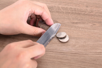 Use a knife to cut off the coins