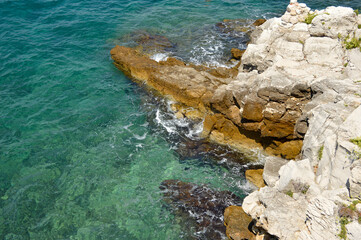 sea coastline with rocks and transparent water