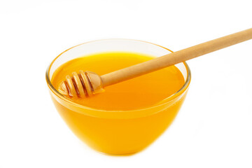 Honey pot and dipper isolated on white background as package design element