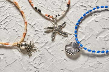 Handmade beadwork, beading as a hobby. Decorations made with your own hands on the background of...