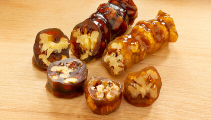 Walnuts on a string dipped in starch grape molasses. Churchkhela. Walnut sujuk.