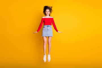 Fototapeta na wymiar Full length body size view of her she nice attractive pretty charming cheerful cheery thin slender skinny funky girl jumping having fun isolated bright vivid shine vibrant yellow color background