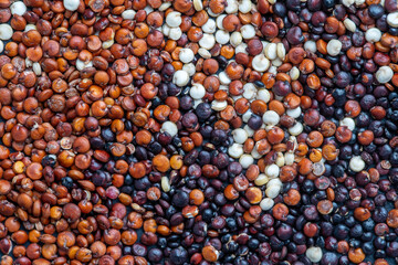 Quinoa seeds on background, close up, top view
