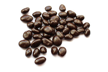 dark chocolate candies with nuts, white background