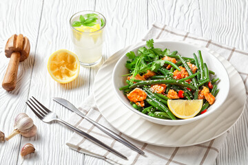Curried salmon with green beans and lemon water