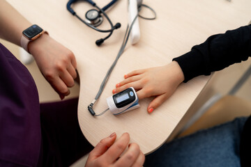 Cardiac finger pulse rate meter for check heart beat and output to monitor. Medical and Healthcare concept. Doctor and patient theme