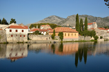 Fototapeta na wymiar View of Old Town of Trebinje on the bank of Trebisnjica river in a sunny day, Bosnia and Herzegovina