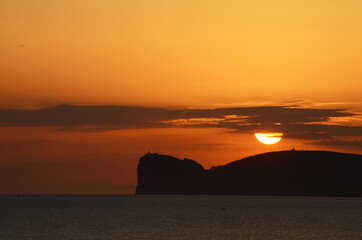 sunset over capo caccia, alghero, sardinia, italy