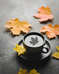 cup of coffee and autumn leaves