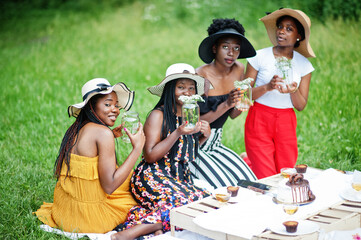 Group of african american girls celebrating birthday party outdoor with decor.