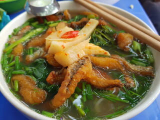 Vietnamese traditional breakfast dishes. Pho, vermicelli, cake.