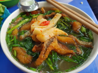 Vietnamese traditional breakfast dishes. Pho, vermicelli, cake.