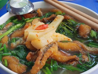 Vietnamese traditional breakfast dishes. Pho, vermicelli, cake.