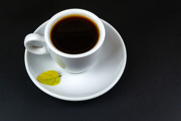Cup of coffee, on a black background.