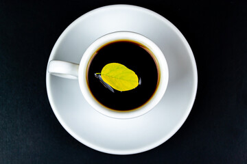 Cup of coffee, on a black background.