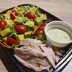 Green vegan salad from green leaves mix and vegetables. eat clean  for heaalthy.Top view on gray stone table.