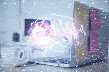 Double exposure of work space with computer and human brain drawing hologram. Brainstorm concept.