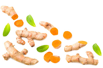 Turmeric root with turmeric slices isolated on white background. Top view.