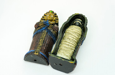 small egyptian sarcophagus with mummy