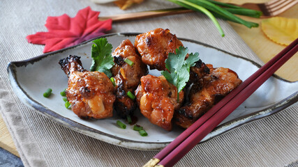 Korean Barbecue Chicken on Dish with Chopsticks